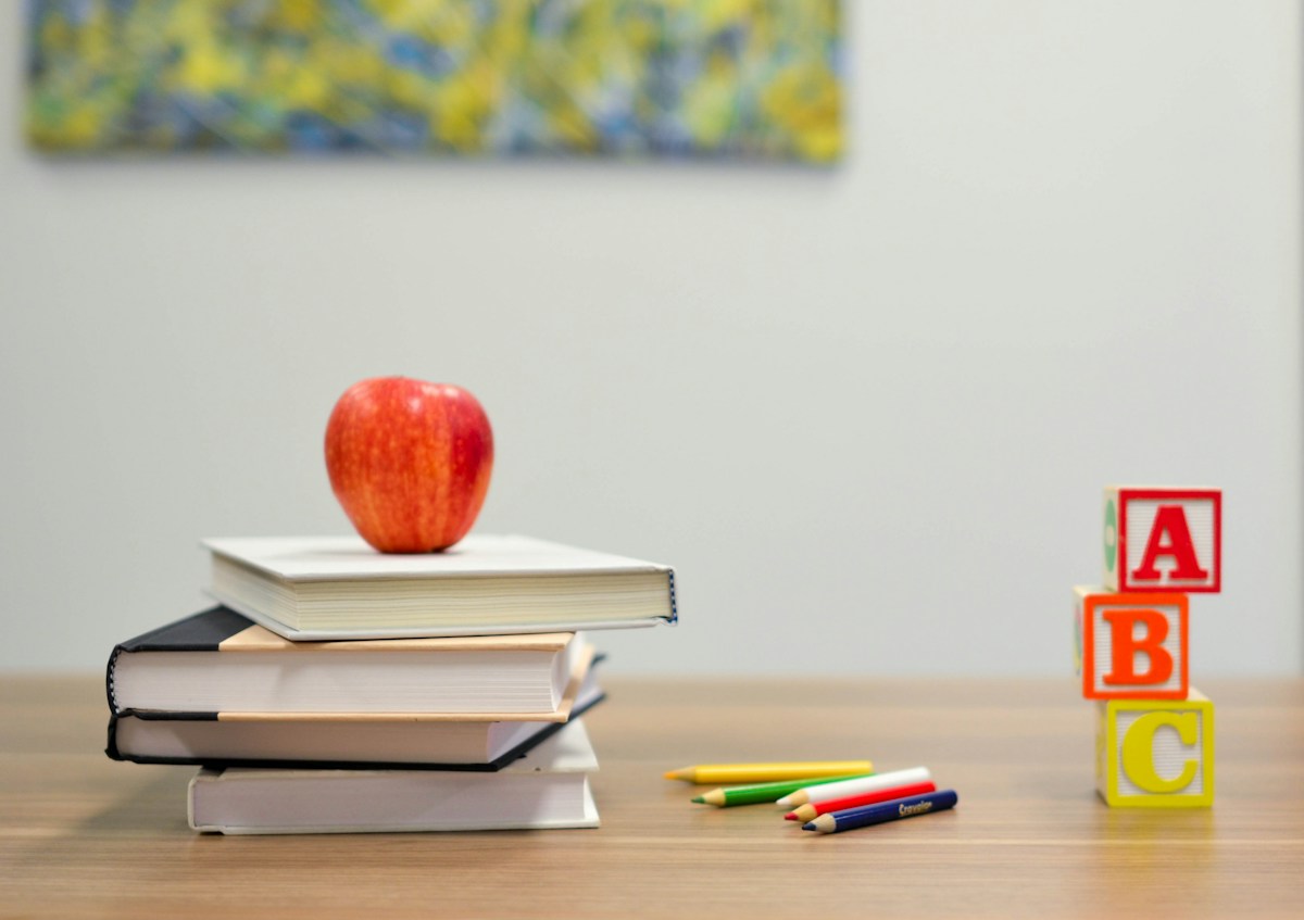 Books and learning materials on a classroom desk